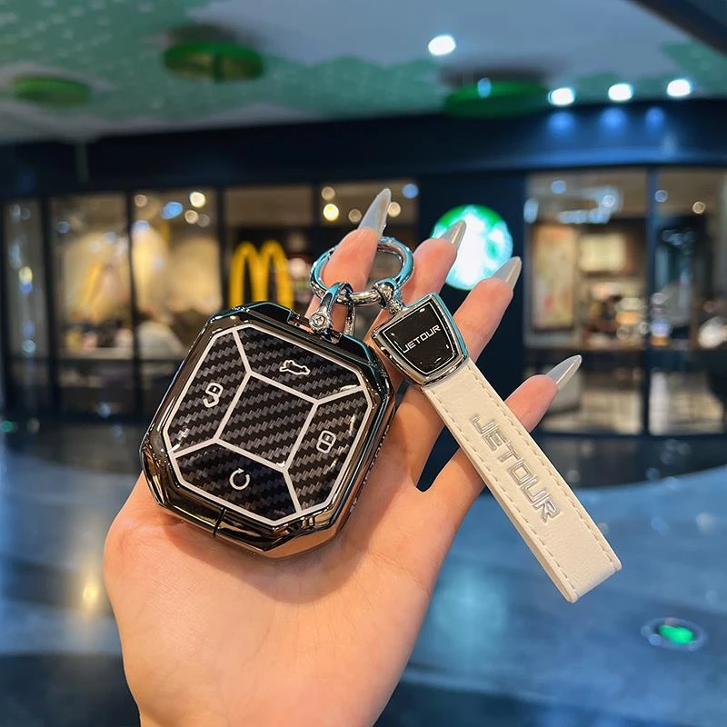 适用于新款捷途旅行者钥匙套奇瑞捷途山海t2碳纤纹渐变金属壳包扣