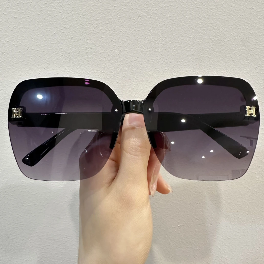 太阳镜女时尚橘色高级防紫外线黑色无框大脸显瘦百搭气质新款墨镜