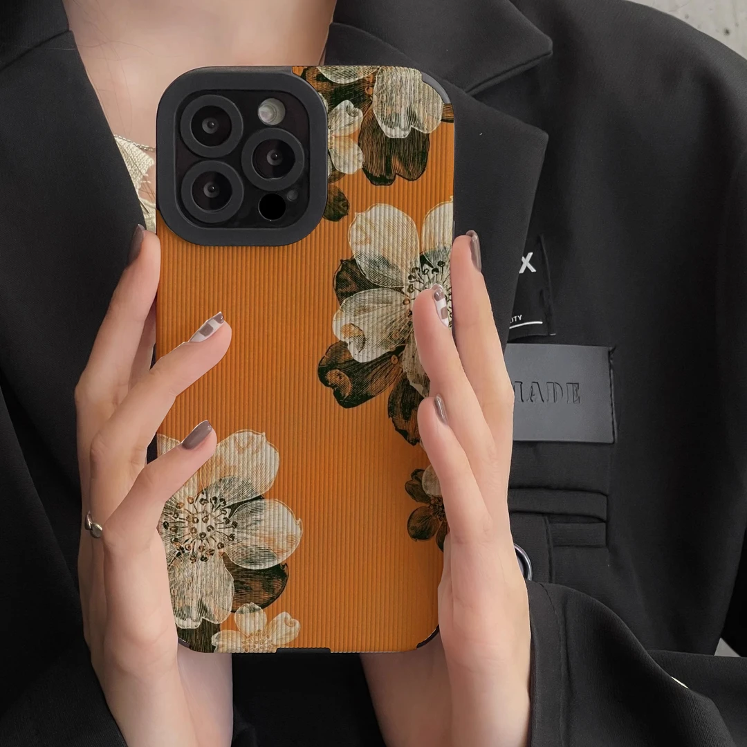 适用苹果15ProMax手机壳14Pro橙底白色山茶花iPhone13竖16promax
