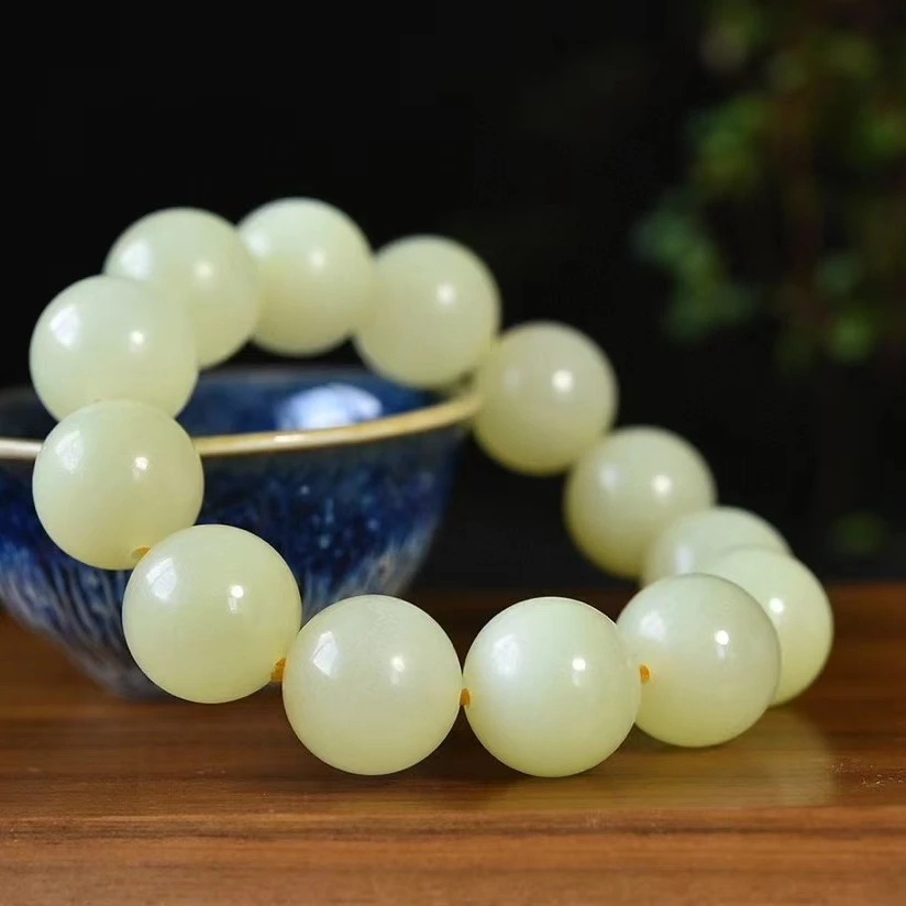 天然和田玉黄口料正圆珠手链尺寸18mm.重113.90克玉质油润色泽柔