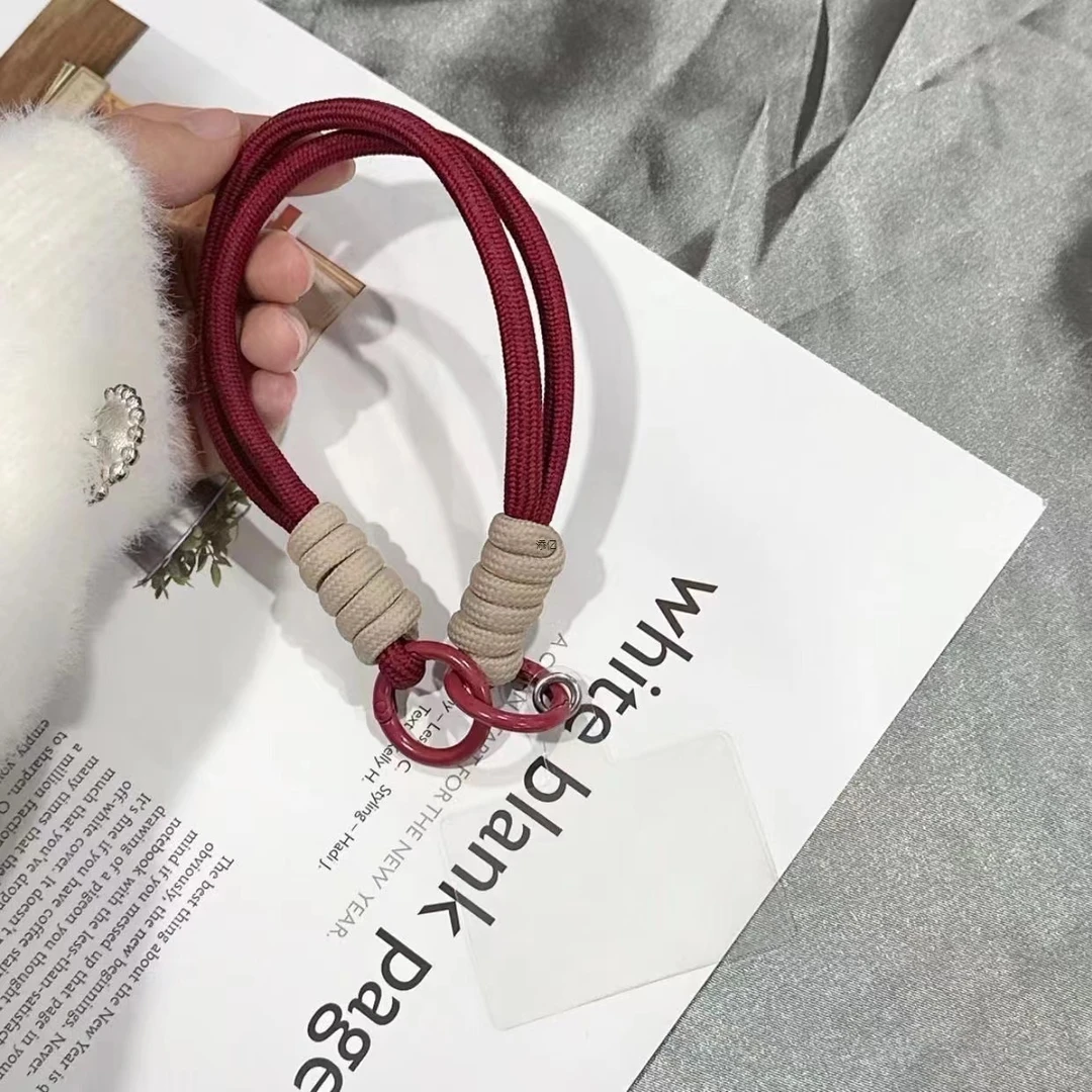 新款秋冬喜庆拼接红色酒红手绳手机壳挂件防丢腕带手提短款挂绳女