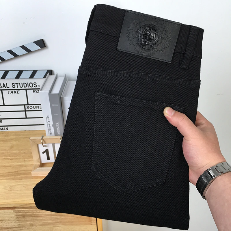 秋冬2025新款黑色百搭牛仔裤男士休闲简约高端修身小脚秋季长裤子
