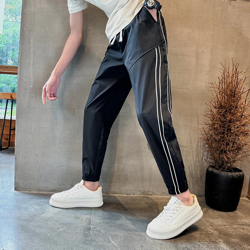 痞帅男裤子潮牌潮流秋冬款条纹束脚九分裤男款修身纯黑色小脚裤