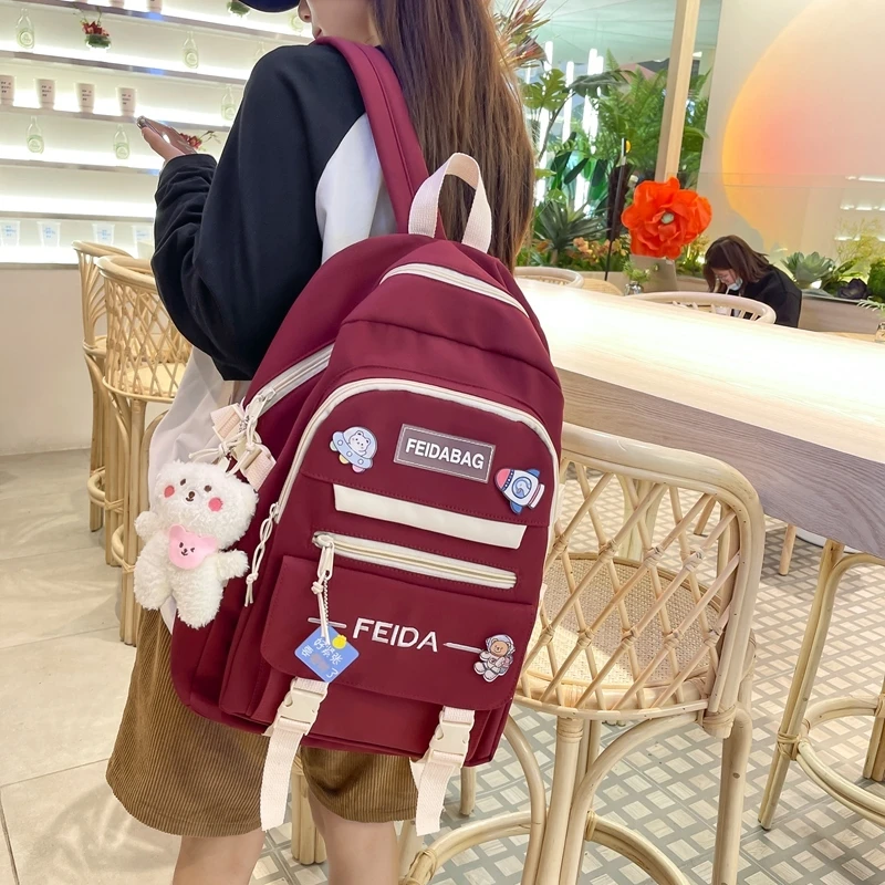 群社书包2025年新款潮中方小学生双肩包飞达网供1072