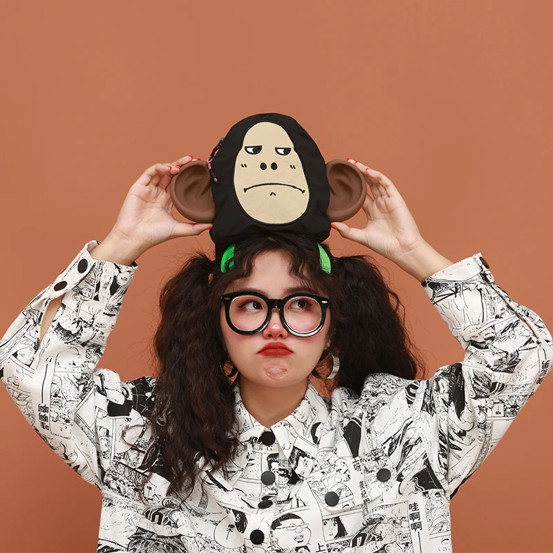 嬉游记原创2023新款丑萌小猴子单肩斜挎包女腰包手机包潮流流浪包