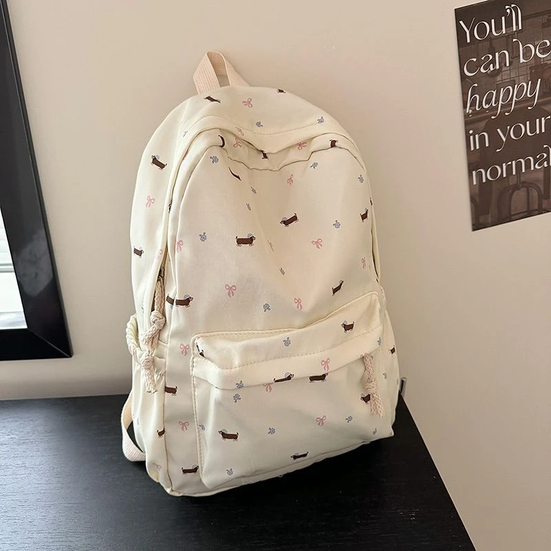 日系小狗可爱双肩包少女碎花背包百搭初中生大学生腊肠狗双肩书包