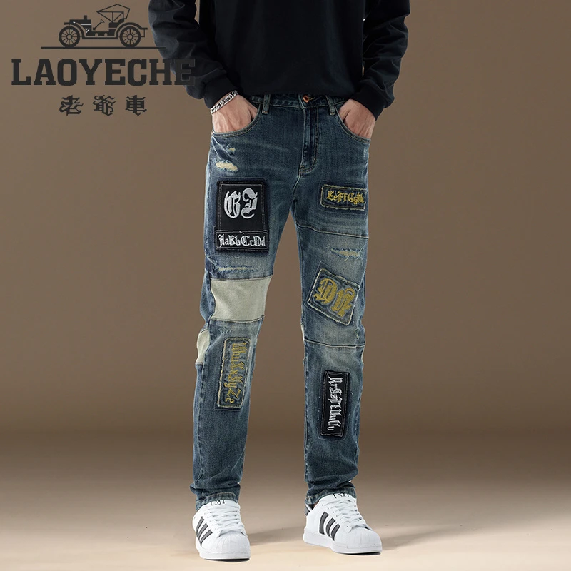 LAOYECHE/老爷车 正品大牌牛仔裤男款欧美个性潮喷墨破洞刺绣贴布