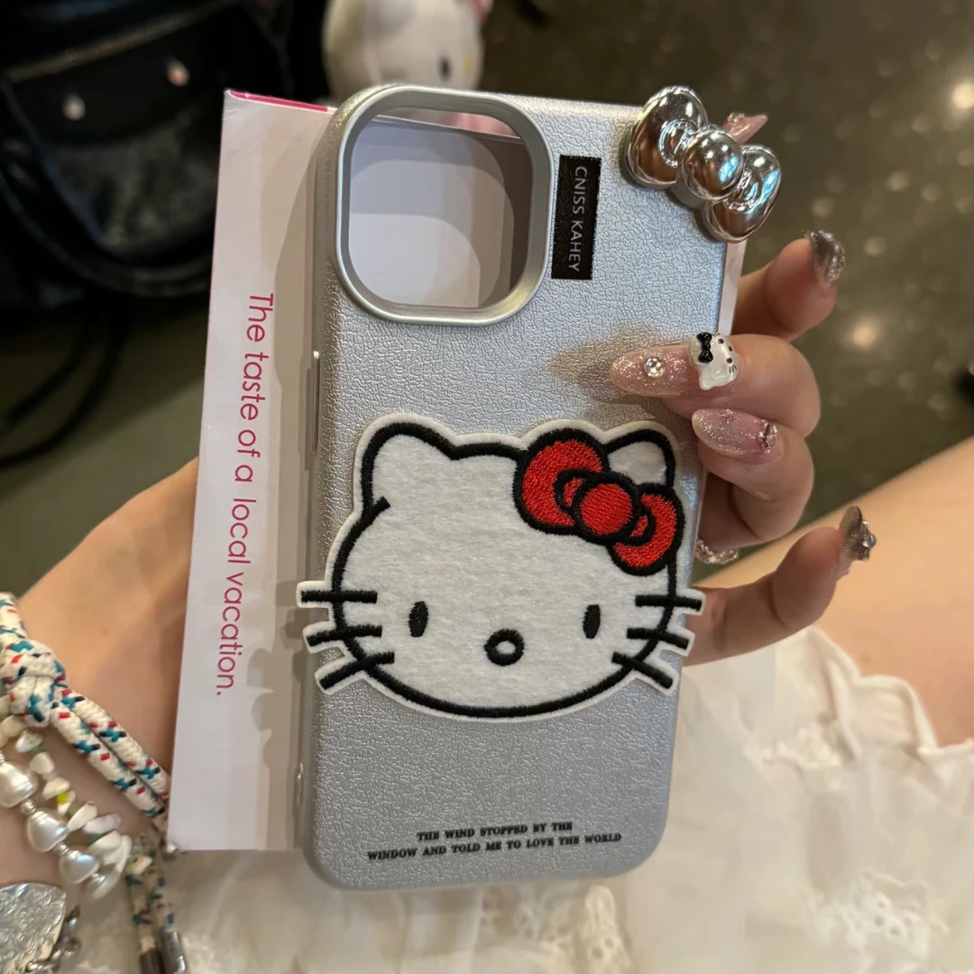 银色大脸刺绣蝴蝶结kitty适用苹果15promax手机壳14ppro全包13/12