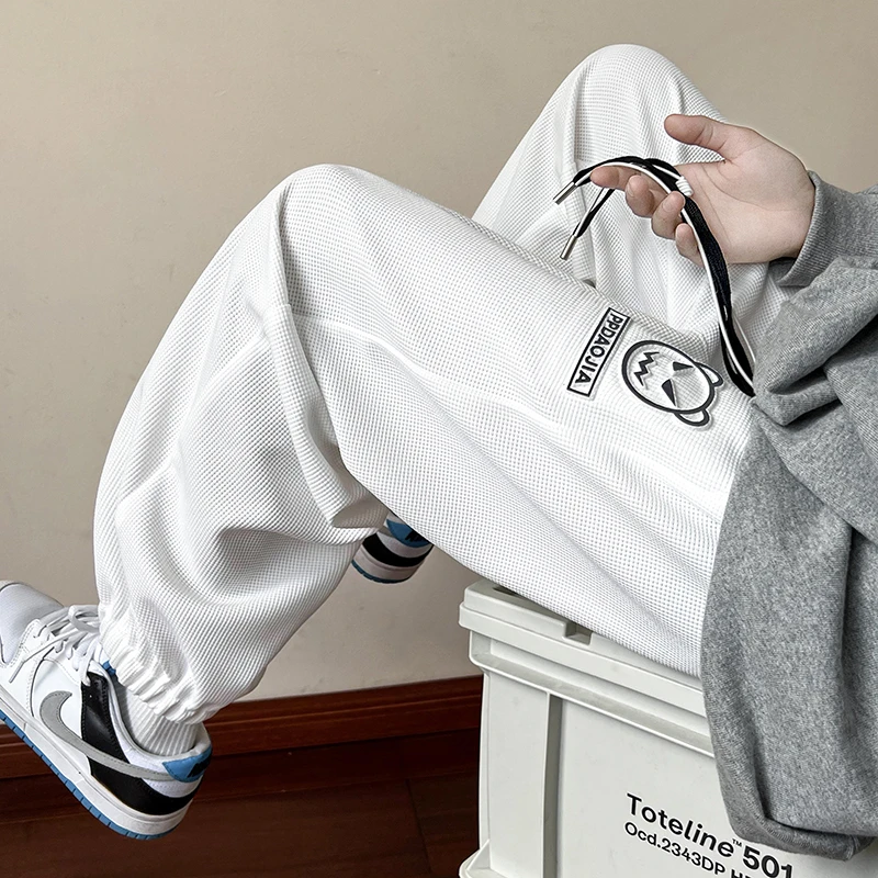 卡通印花休闲裤男夏季薄款华夫格九分裤宽松束脚运动裤男士裤子