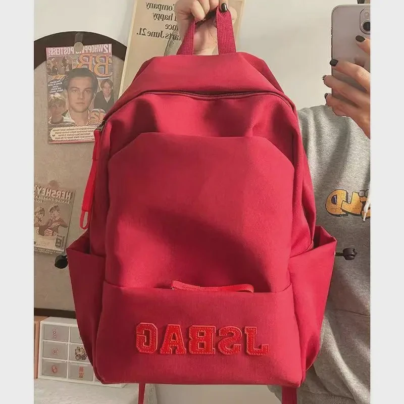 新款男女同款纯色大容量原创初高中加大容量大学生电脑包旅游登山