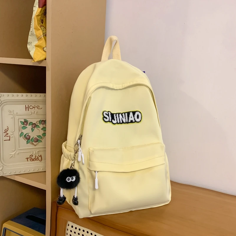 芭特莉书包 初中生日简约大容量学生包纯色校园背包轻便女生护脊