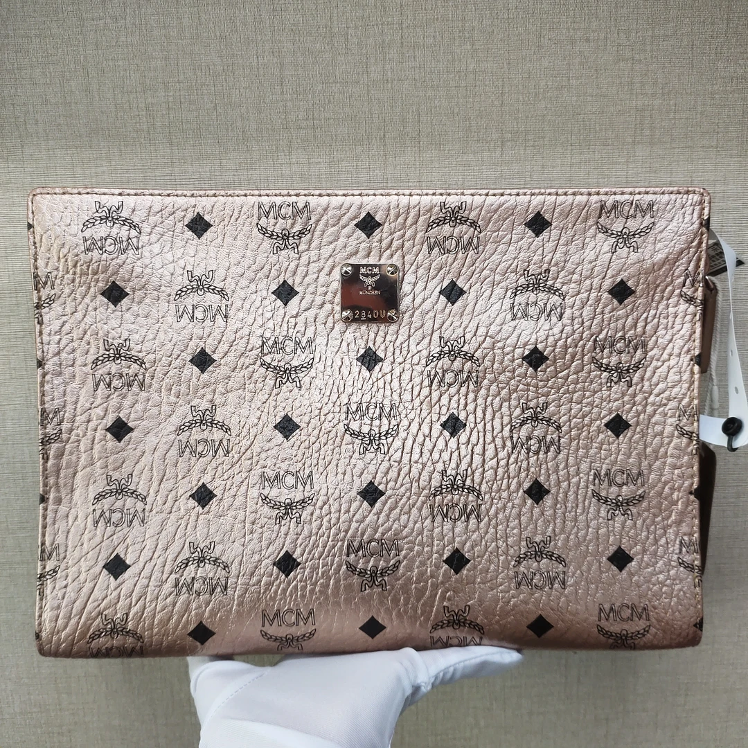 95新 MCM 玫瑰金手拿包/优尔严选/51869