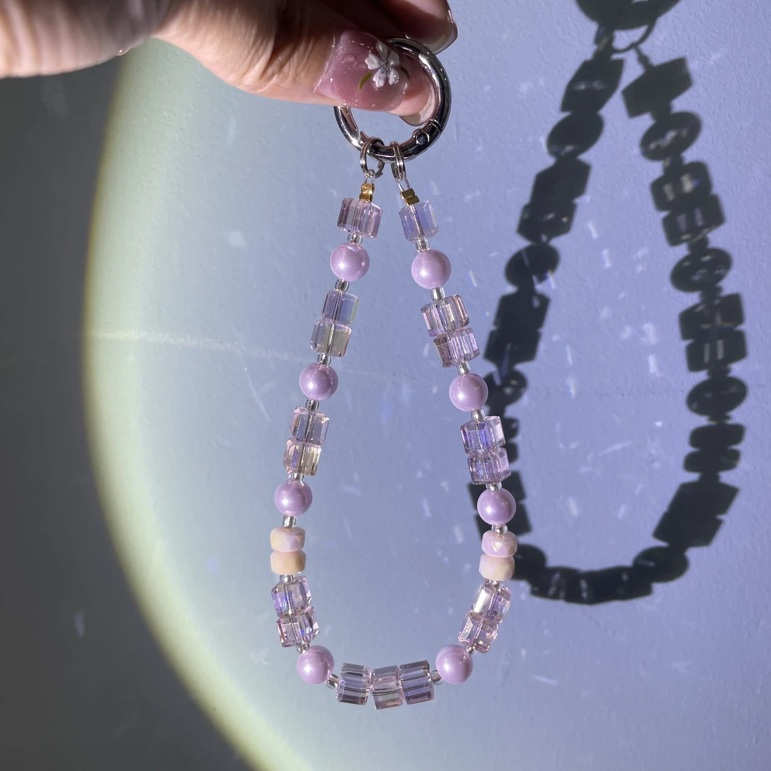 编织粉方糖紫珍珍款手机链C741