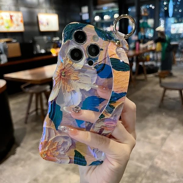 适用苹果系列iPhone16新款手机壳扭扭边小众蓝光腕带杏花复古防摔