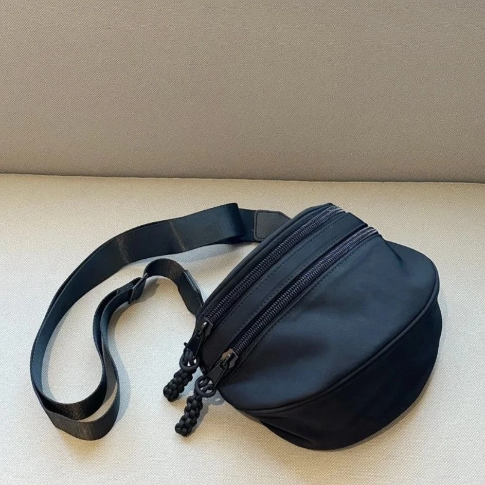 斜挎包女包新款防水牛津布潮流马鞍包单肩挎包个性绳结流苏百搭