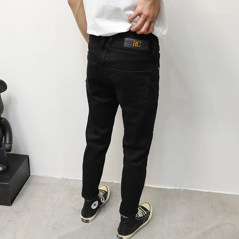 纯黑色经典韩版九分小脚裤牛仔裤男2025秋季百搭修身弹力潮流裤子