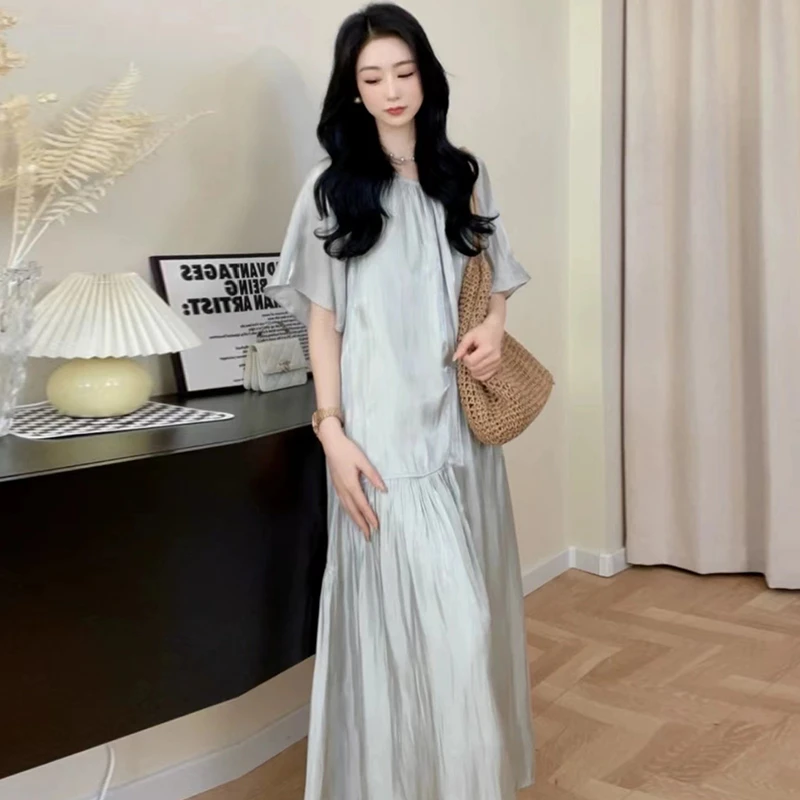 2025夏季新款轻奢气质镂空连衣裙宽松韩版宽松大码短袖过膝长裙女
