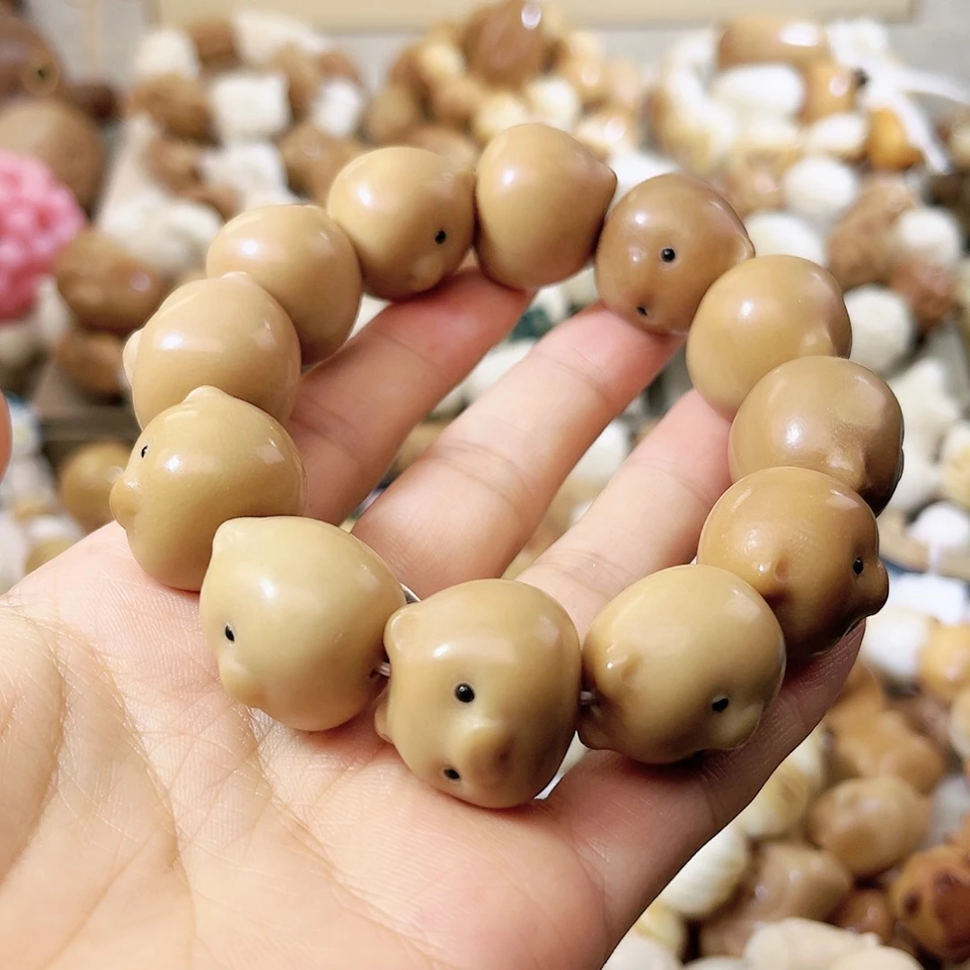菩提根/象牙果手串小猪七折（瑕）