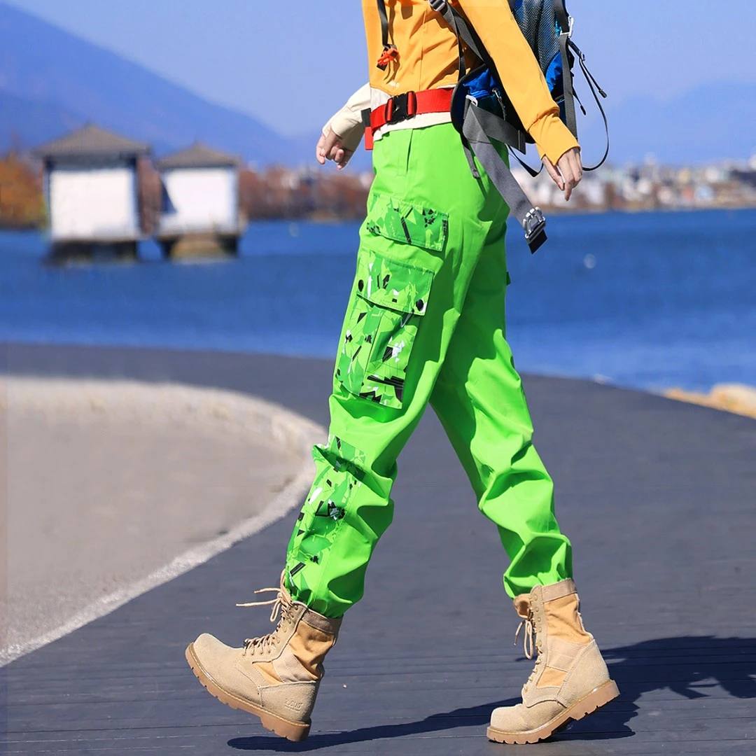 雪丘岛户外休闲迷彩拼色裤子防风防水全压胶登山耐磨冲锋裤女士