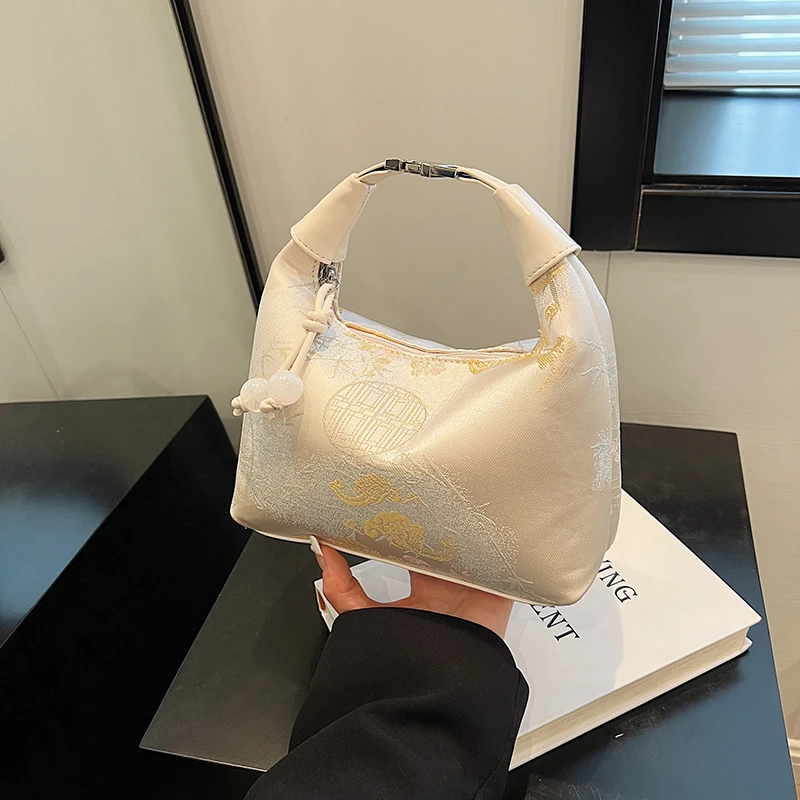 新中式手拎包包女2025新款潮时尚休闲单肩包国风百搭通勤斜挎包