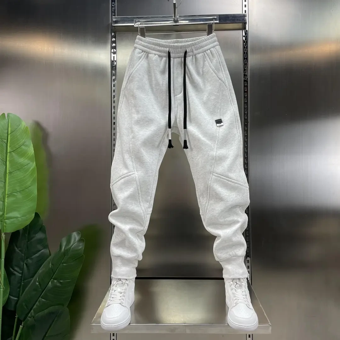 2025冬季新款暖绒加厚加绒休闲百搭小脚裤拉链神裤潮流运动休闲裤