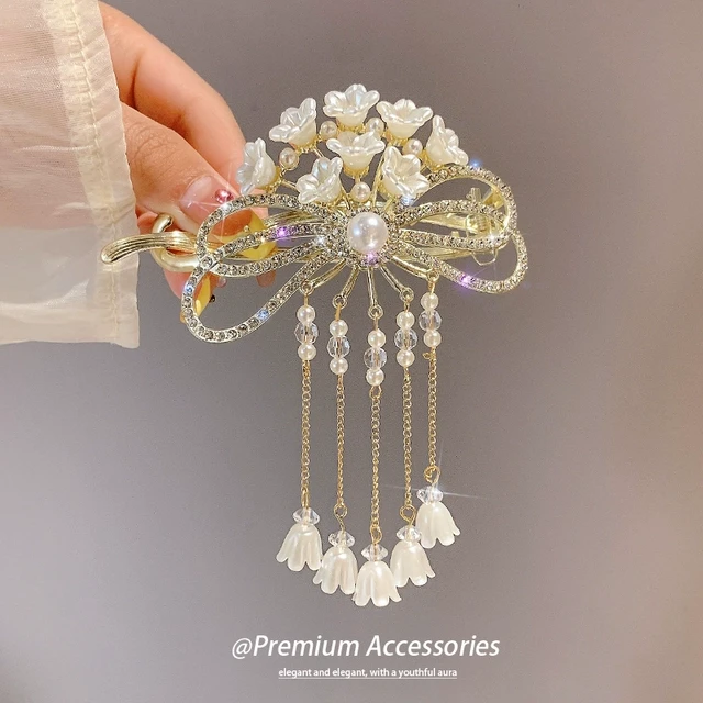 珍珠铃兰花发夹女后脑勺盘发卡子头饰轻奢高级感流苏扭扭夹发饰新