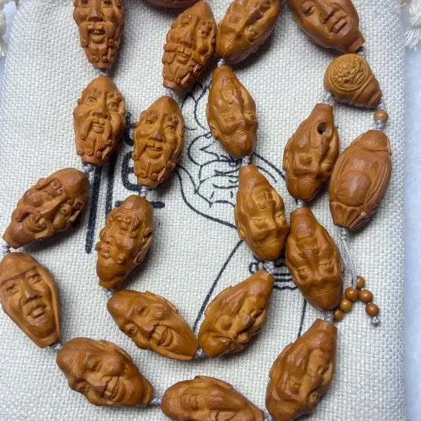手工橄榄核雕刻怪脸罗汉文玩长串适合男女盘玩