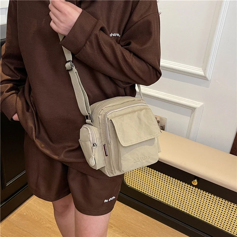 男女同款斜挎包时尚百搭流单肩包多功能简约尼龙小包包韩版H496