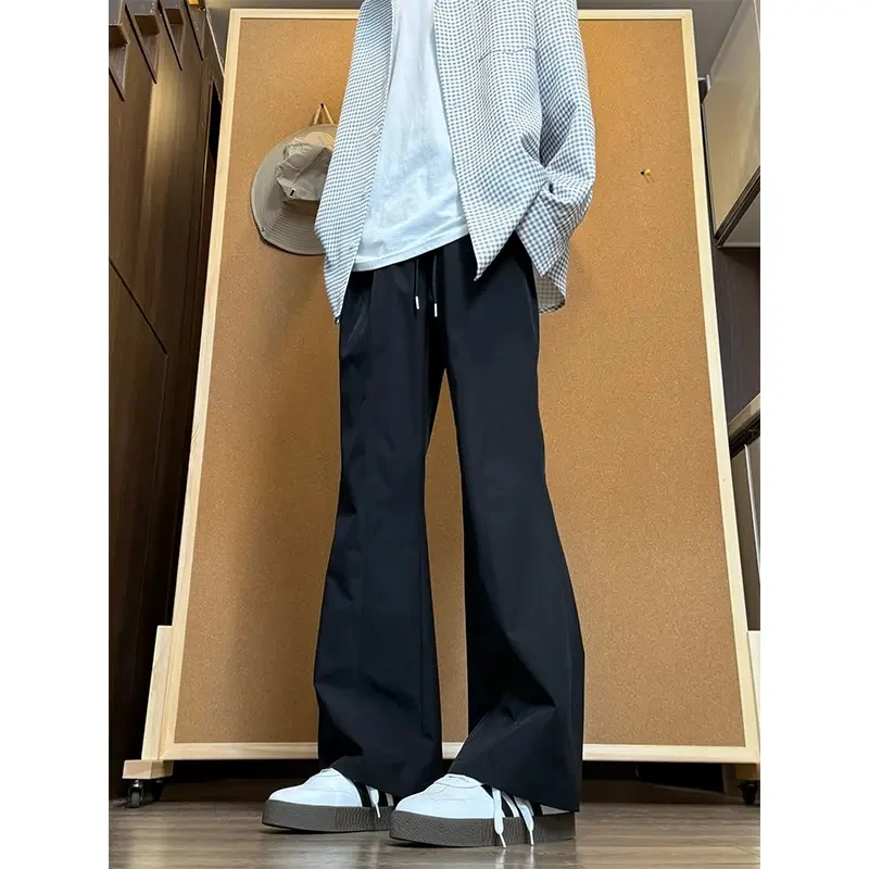 黑色尼龙速干防水冲锋裤男款夏季潮牌美式vibe斜切微喇裤子弯刀裤