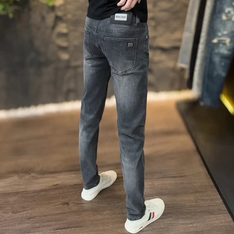 秋冬季潮流韩版牛仔裤欧货男士时尚商务修身弹力休闲百搭直筒长裤