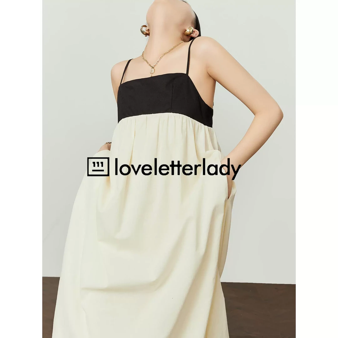 周里物黑白撞色吊带连衣裙女2025春季新款法式时尚露背长款蓬蓬裙