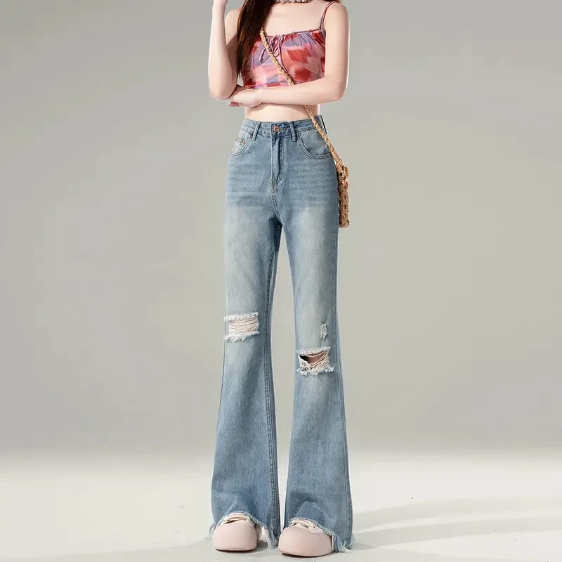 2025年春夏新款浅色微喇叭牛仔裤女设计感破洞高腰马蹄阔腿拖地裤