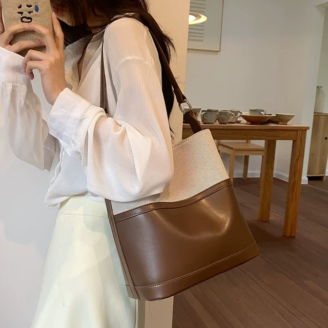 韩国高级感拼接水桶包女新款复古森系单肩包通勤上课大容量腋下包