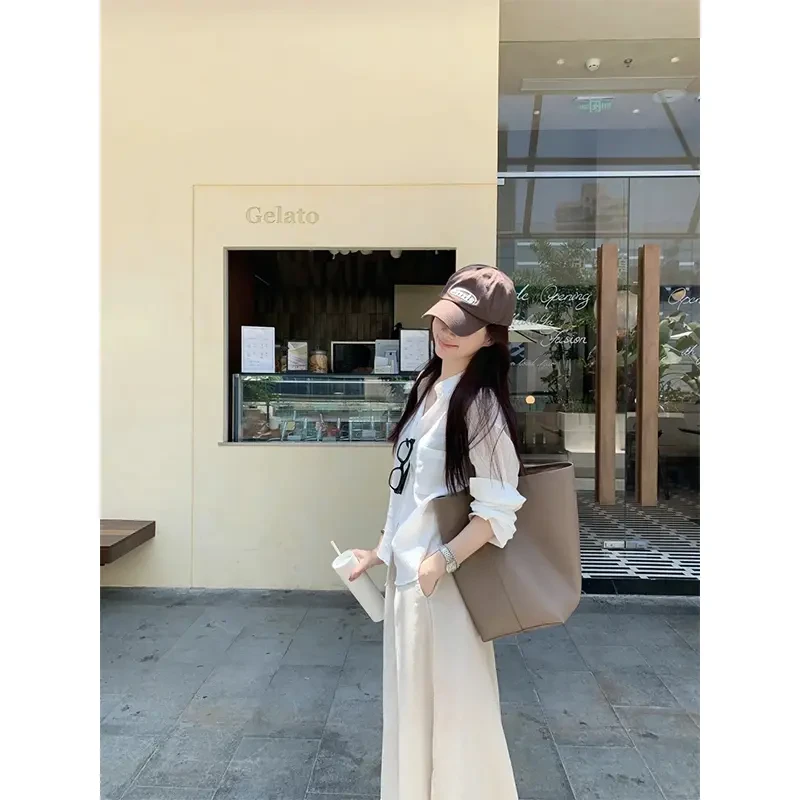 早春穿搭一整套女装2025洋气休闲显瘦长袖衬衫高腰百搭开叉半身裙