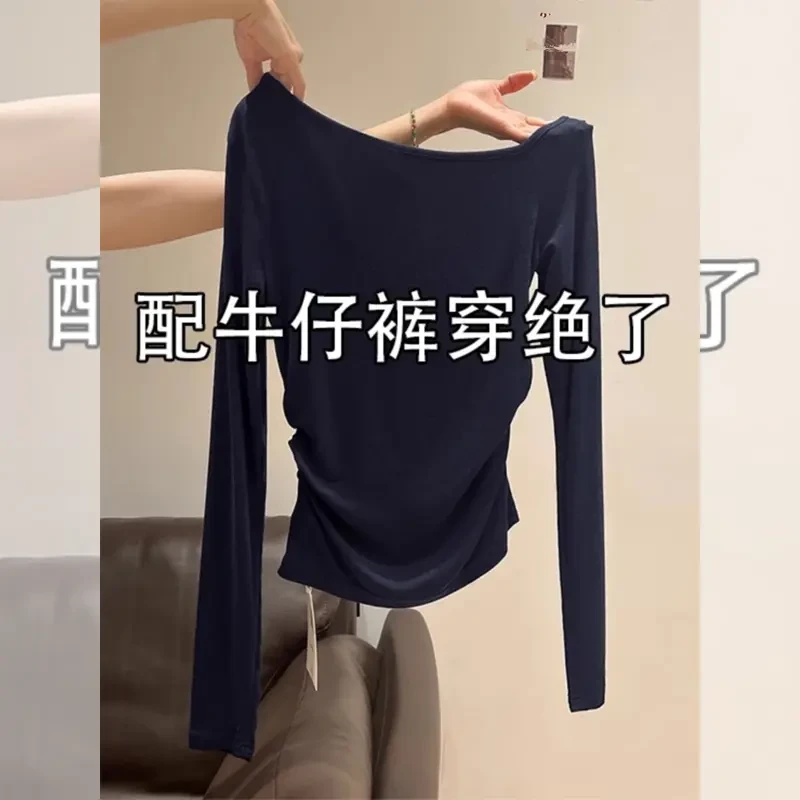 藏蓝色纯欲露骨辣妹长袖T恤女秋季褶皱收腰打底内搭斜肩上衣
