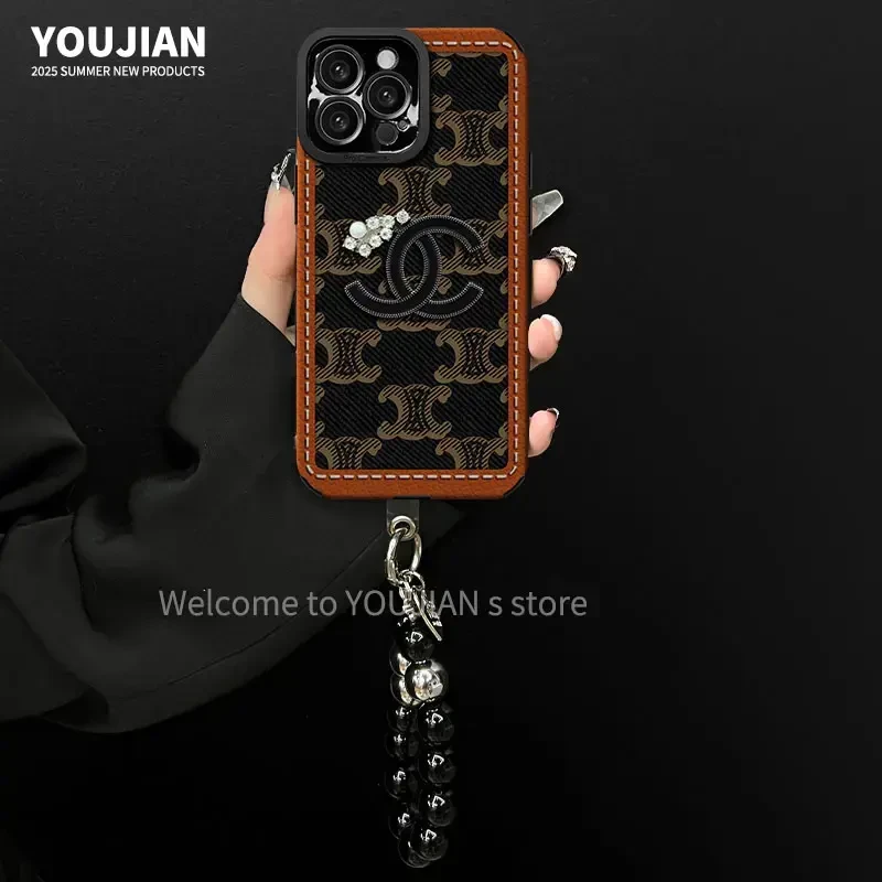 复古潮牌瞳眼翻毛皮花洞适用苹果16华为vivo小米oppo手链手机壳女