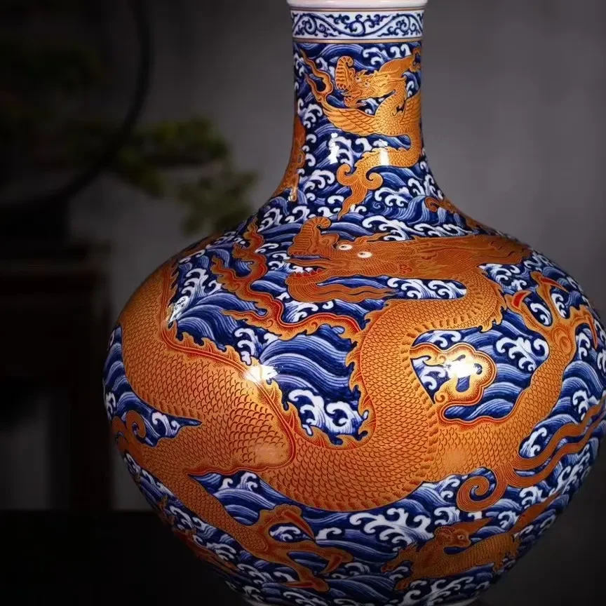 宣之堂青花暗刻矾红描金龙生九子天球瓶