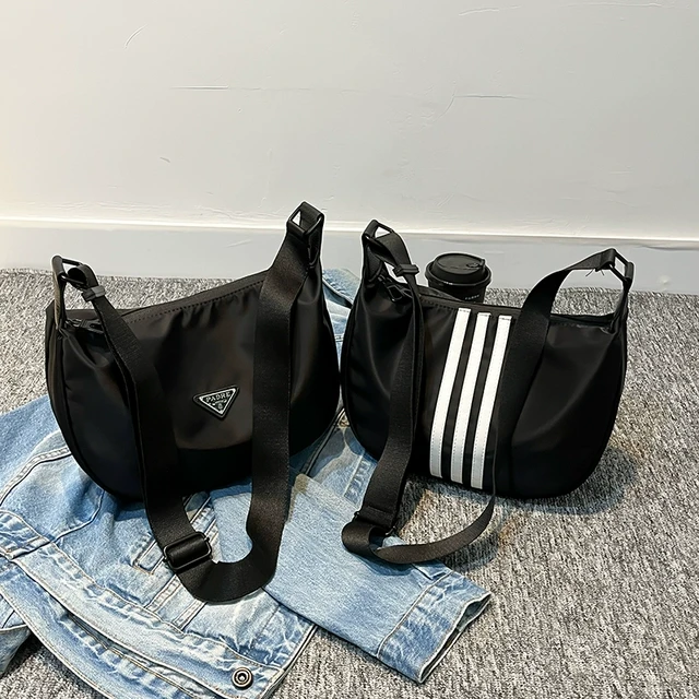 休闲运动风尼龙布包包女2025新款ins潮流单肩斜挎包男女款饺子包