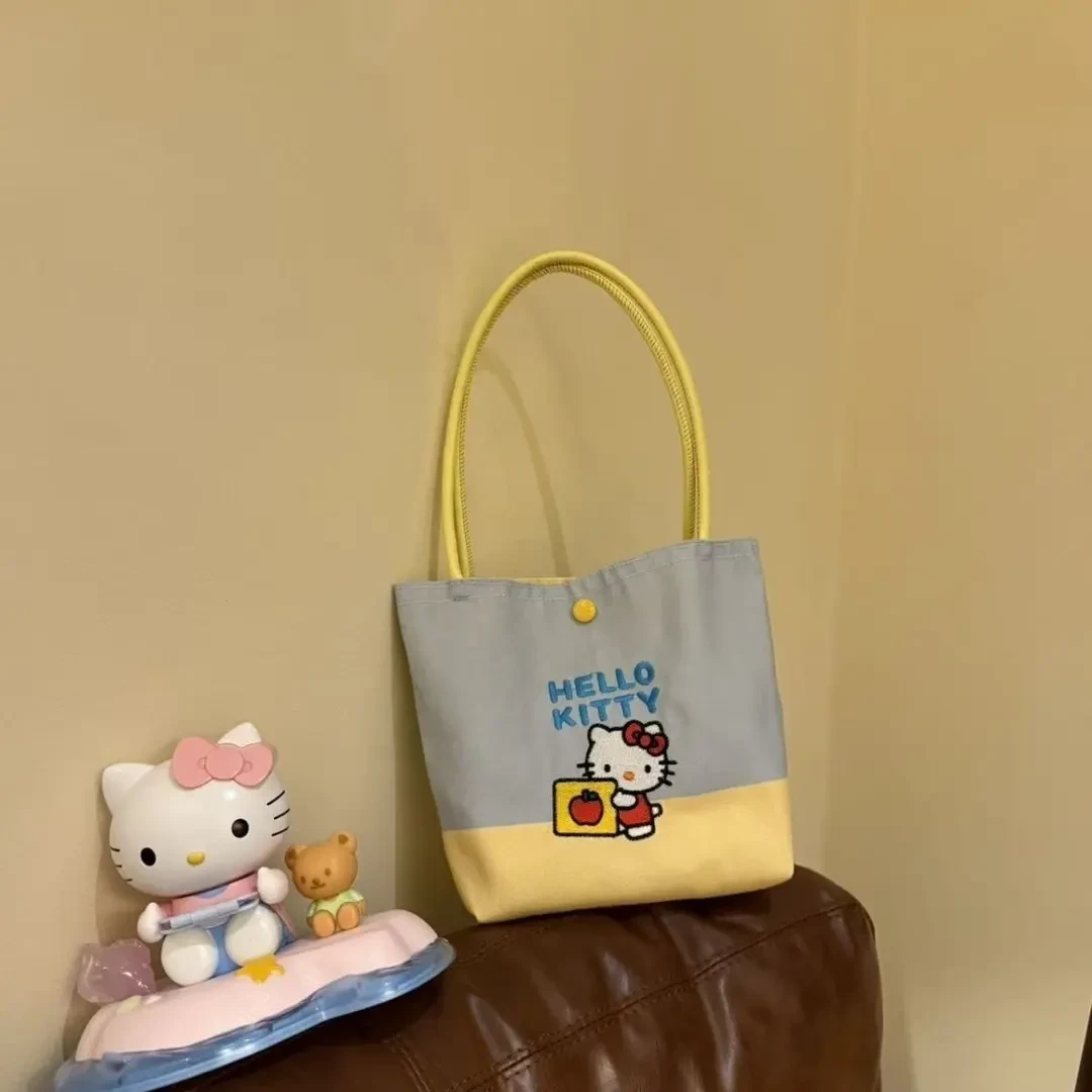 新款小KT猫咪卡通手提包手拎包女手腕包少女心可爱帆布包通勤包包