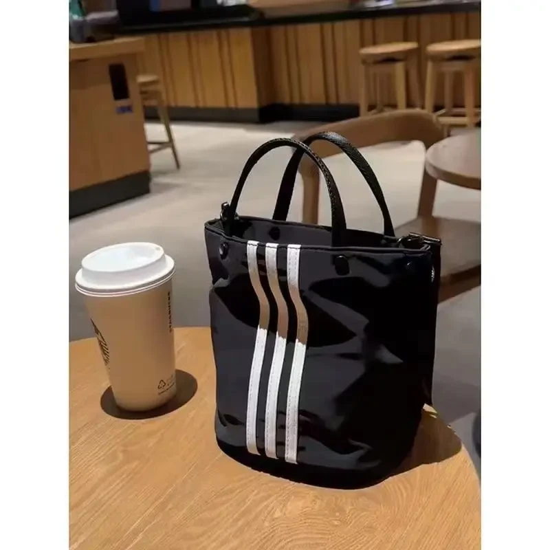 小众三条杠手提包休闲百搭水桶包新款尼龙小拎包单肩斜挎包女潮流