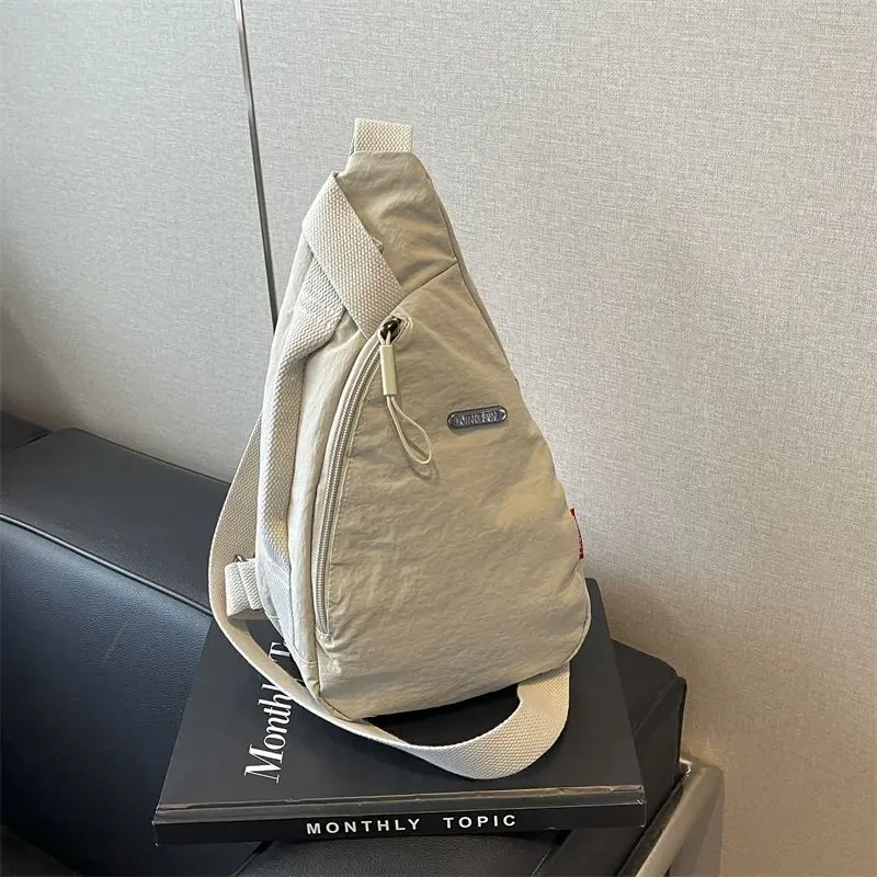 帆布斜挎包女2025新款简约时尚便捷单肩包潮牌胸包男生休闲运动