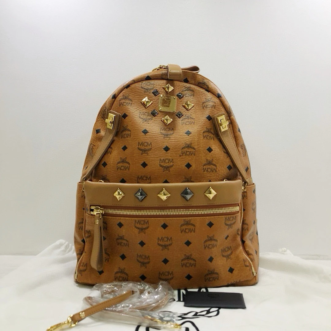 95新 MCM 干邑色印花铆钉大号双肩包/公价8800