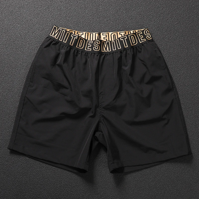 黑色运动短裤男跑步健身训练速干宽松弹力沙滩裤夏季休闲四分薄款