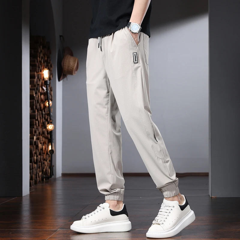夏季薄款休闲裤男宽松束脚潮流运动长裤2025新款简约速干冰丝裤子