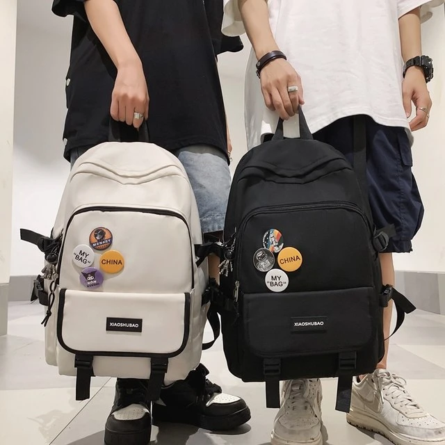 书包男生大学生高中简约背包女初中生小学生大容量双肩包时尚百搭