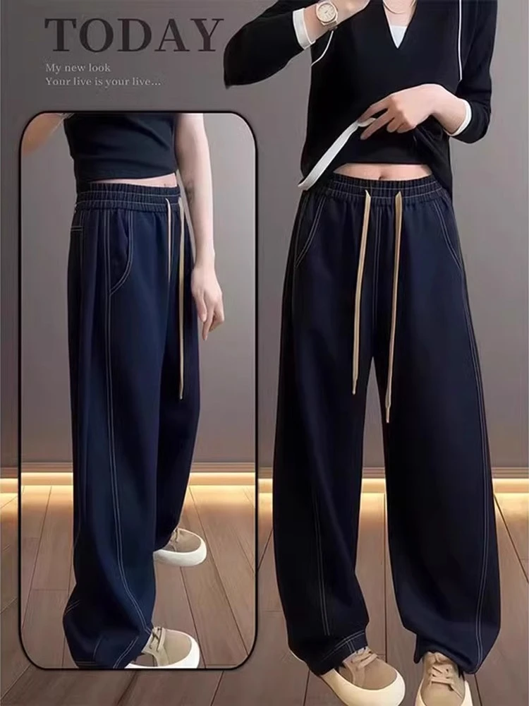 深蓝色弯刀牛仔裤女秋季设计感显瘦松紧腰大码梨型身材直筒阔