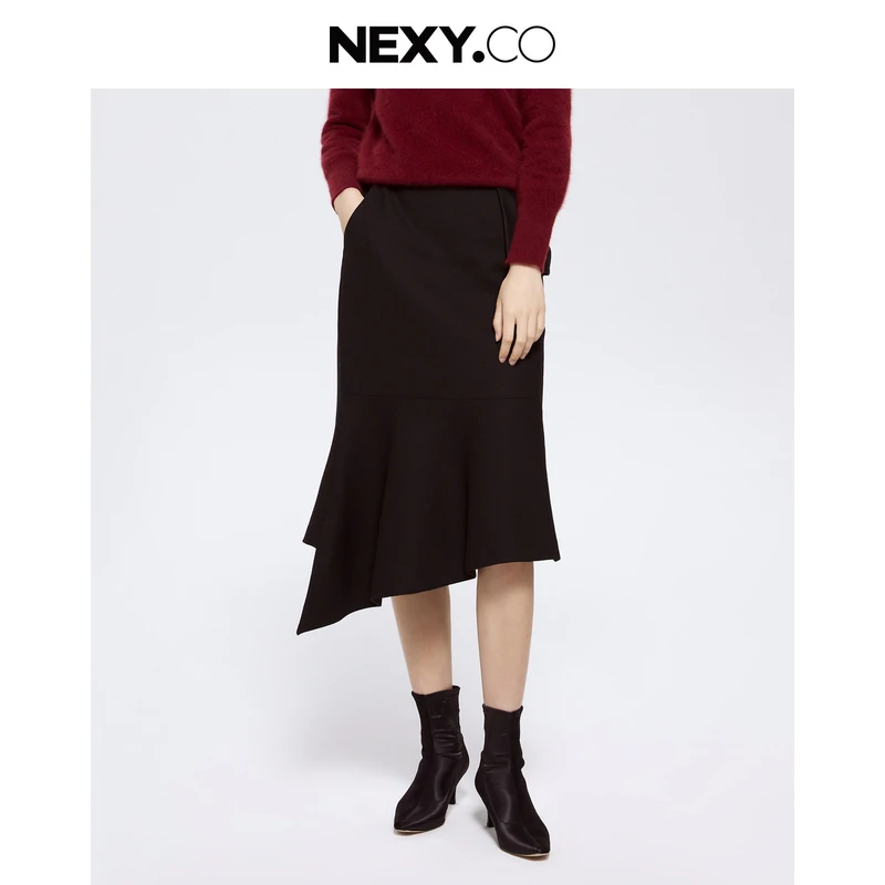 NEXY.CO/奈蔻半身裙秋冬新款通勤黑色不规则中长款显瘦XW00949W0