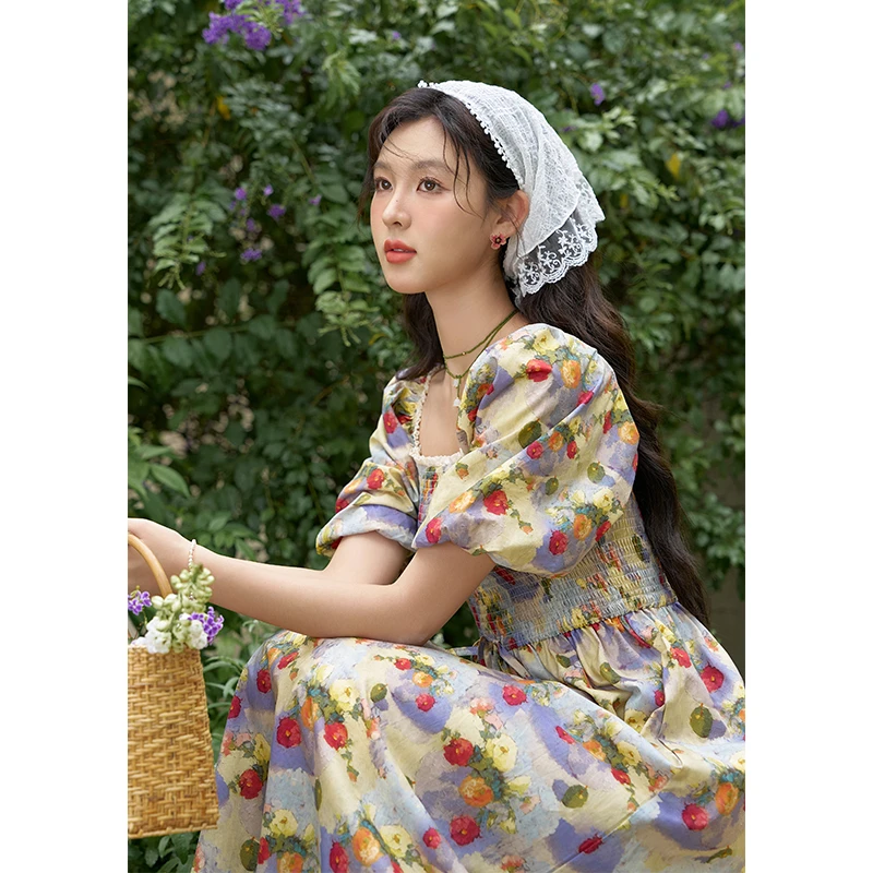 谜秀新品法式复古油画碎花连衣裙女显瘦泡泡袖海边度假沙滩裙印花