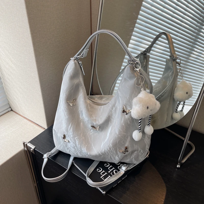 大容量通勤双肩包包女式2025新款时尚蝴蝶腋下单肩包百搭托特包包