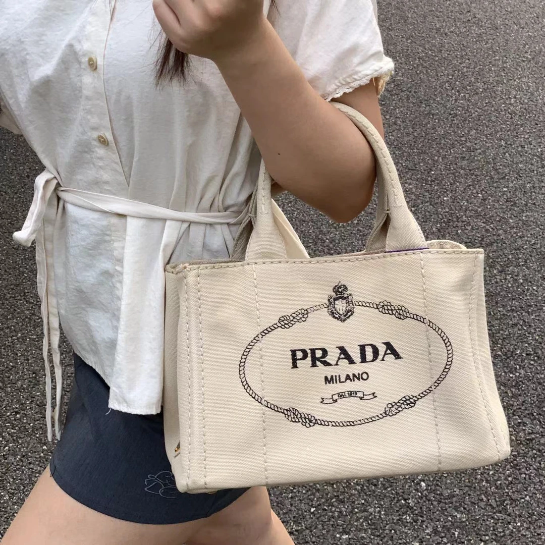 95新 Prada/普拉达 一口价沙滩杏色小号手提斜挎包c